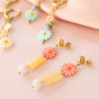 Comment incorporer des perles coquillage en forme de fleur dans votre collection de bijoux